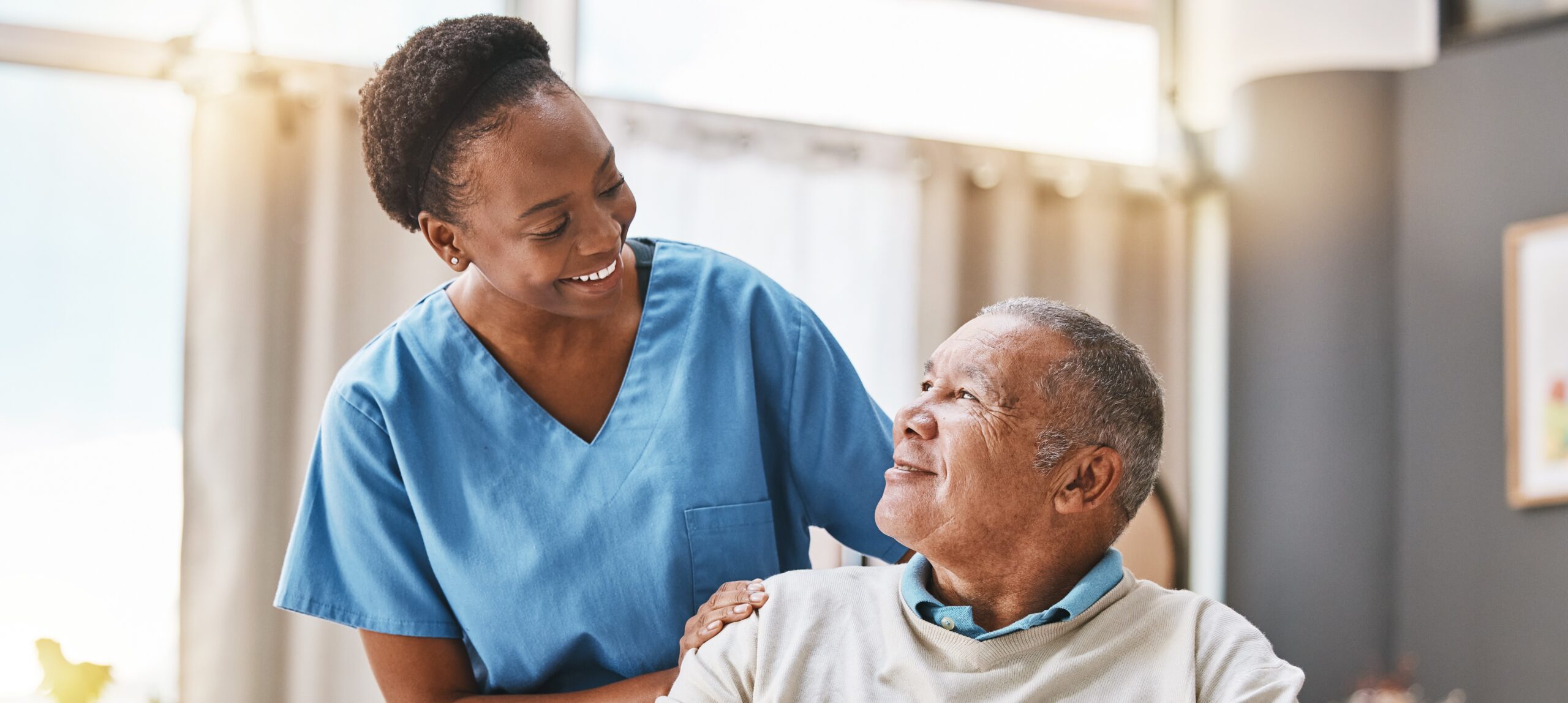 Care professional supporting an older person